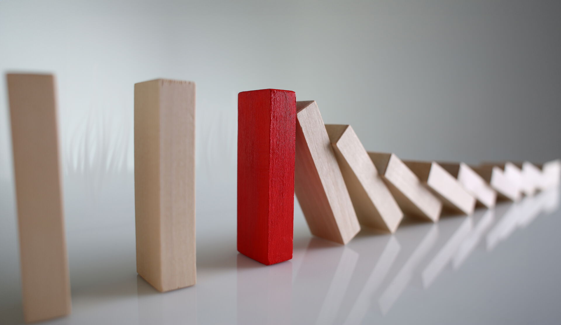 One red domino brick blocks the process