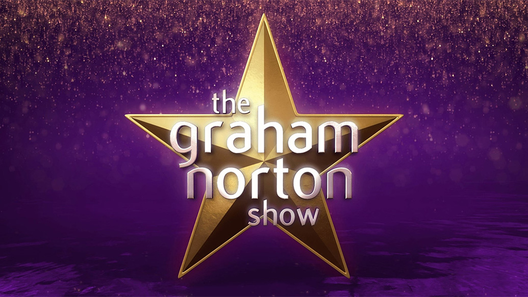 The logo of the British TV show The Graham Norton show featuring a gold star on a purple background with the show's name in white letters over the star.