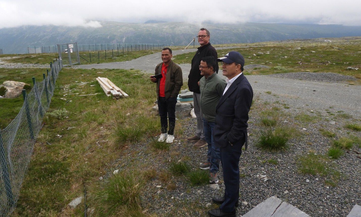 Three men are looking for arctic foxes