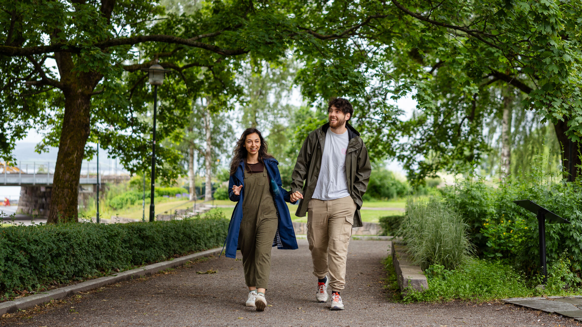 Daniela and Aedan are walking through a park