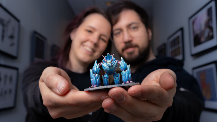 Picture of Jannice and Per Kristian holding a blue figure