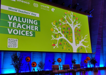 Image showing a large green board with a tree and statement: Valuing Teacher Voices