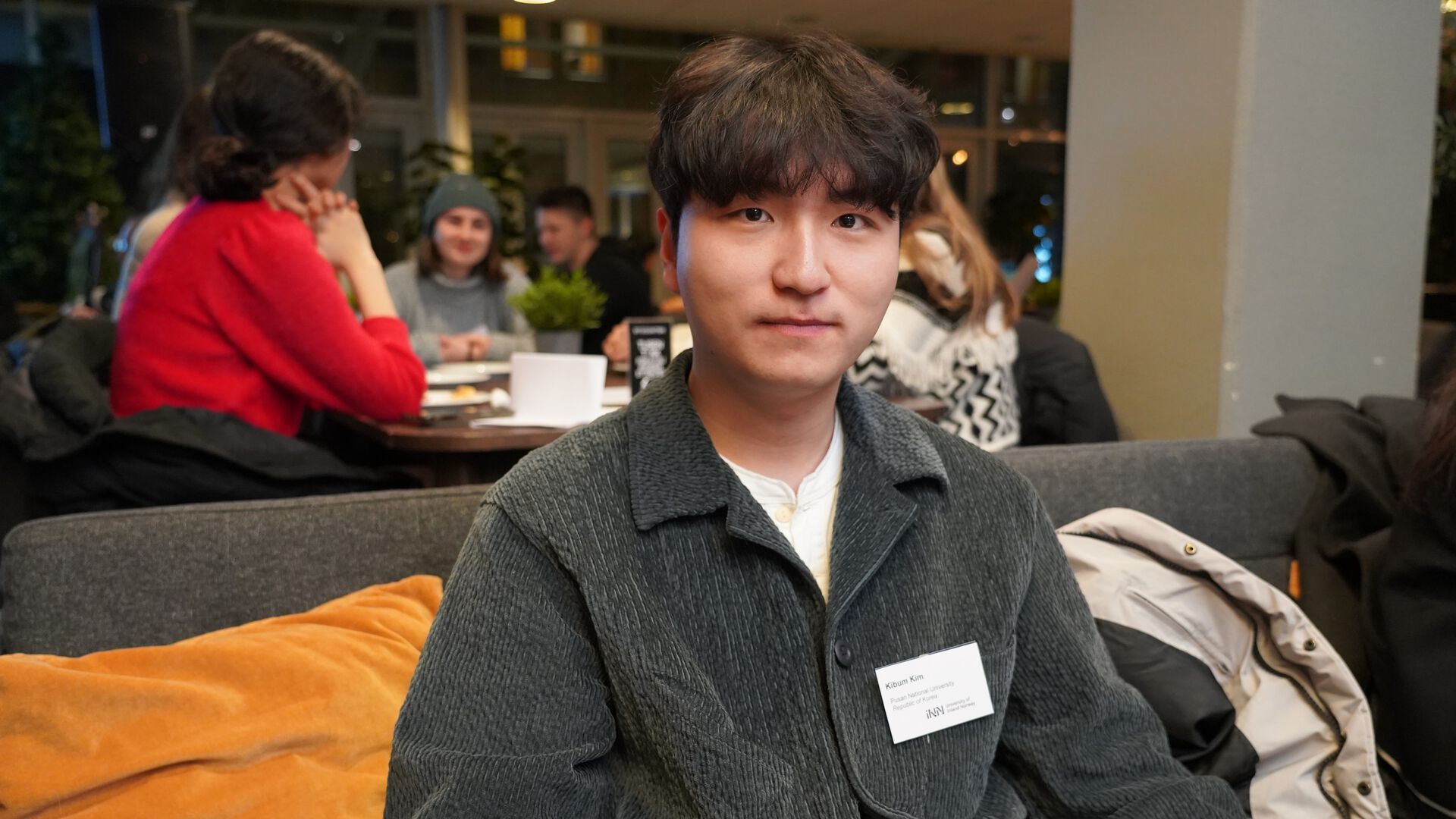 Portrait of Kibum Kim sitting in a sofa