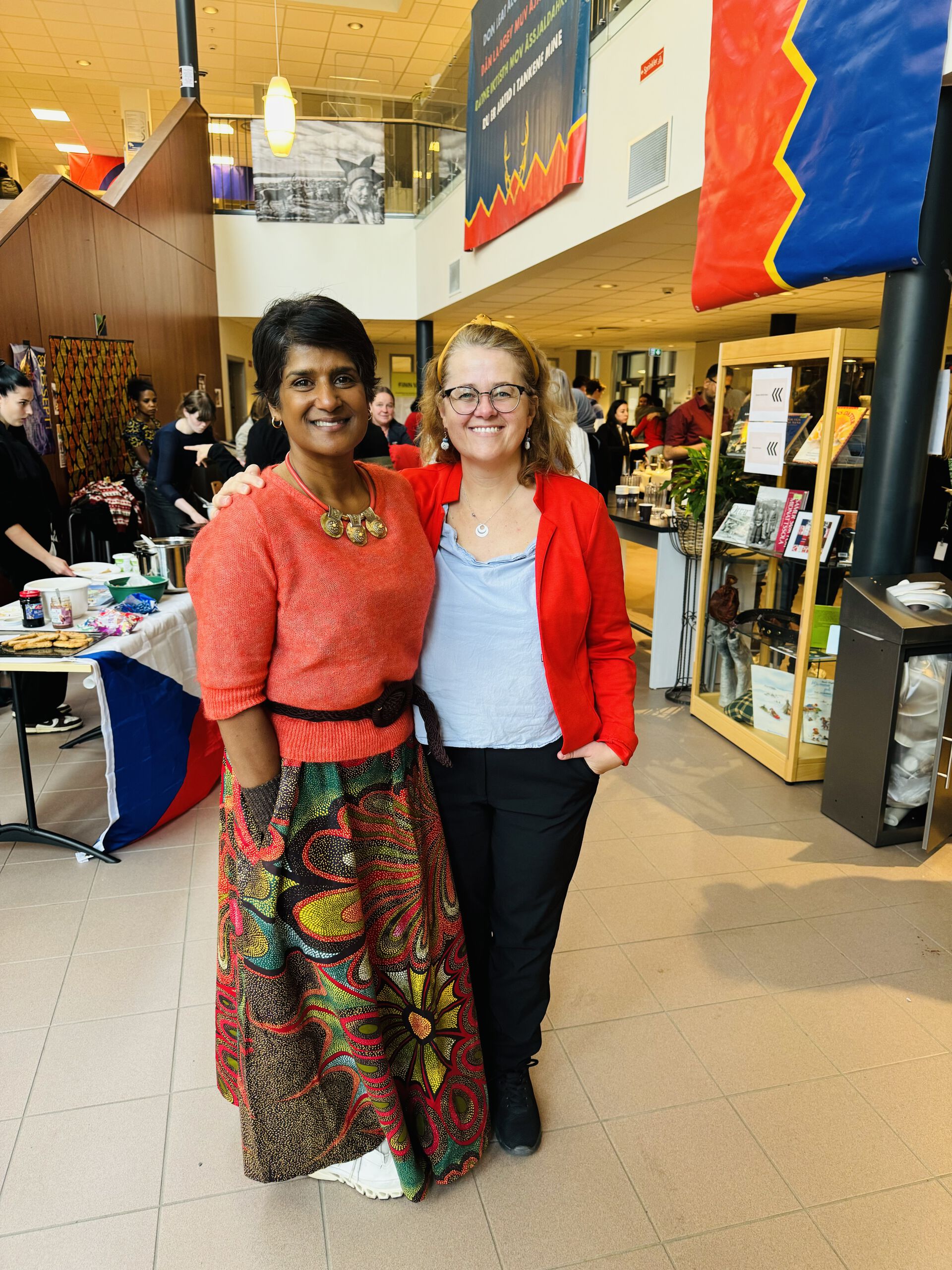 Toril and Sevika are smiling at the event