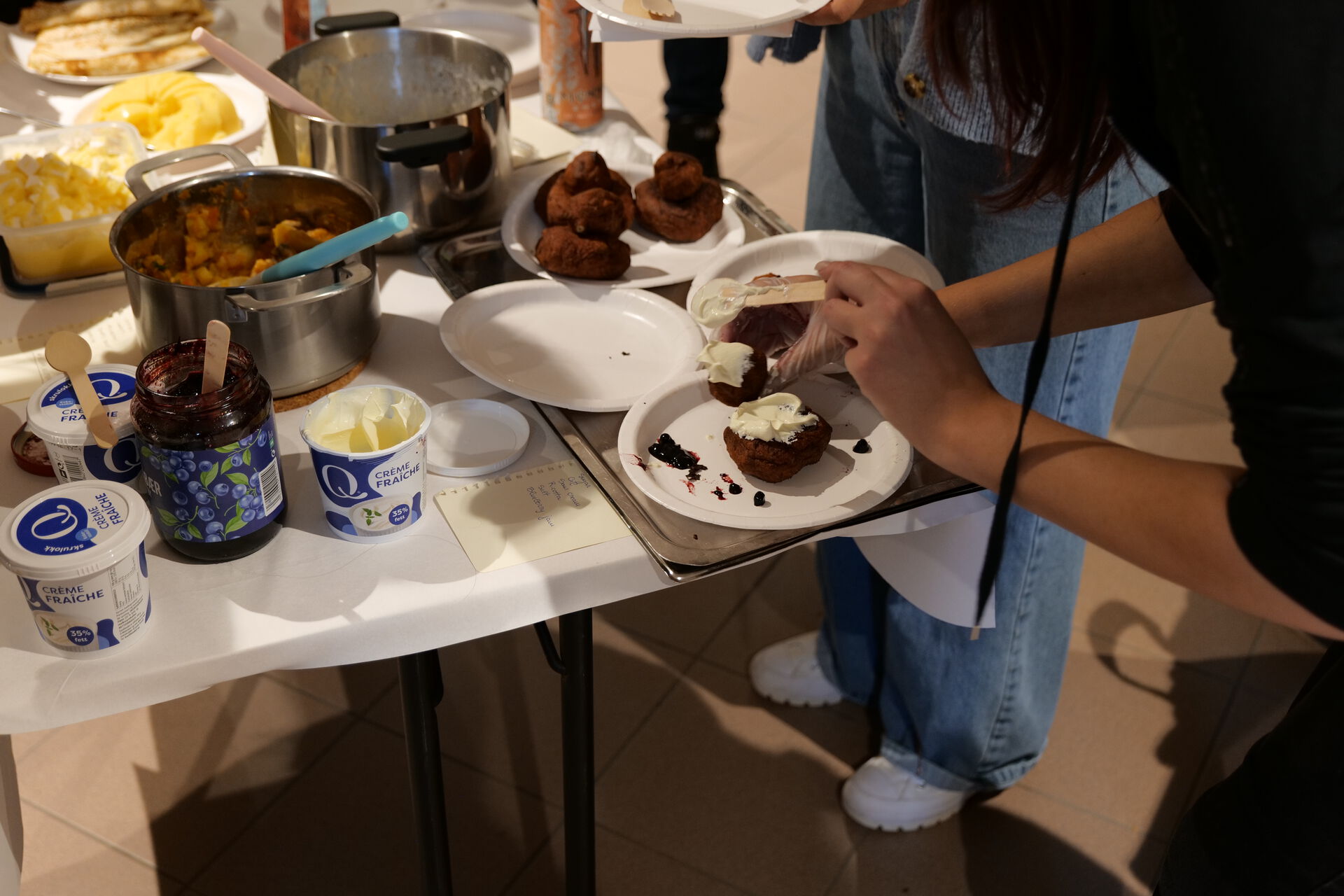 A person is fixing their plate of food