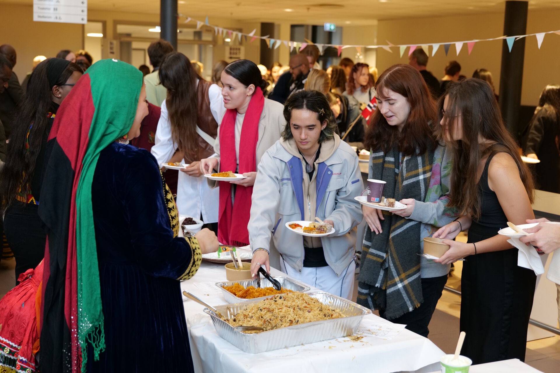 Three students are in line for Afghani food