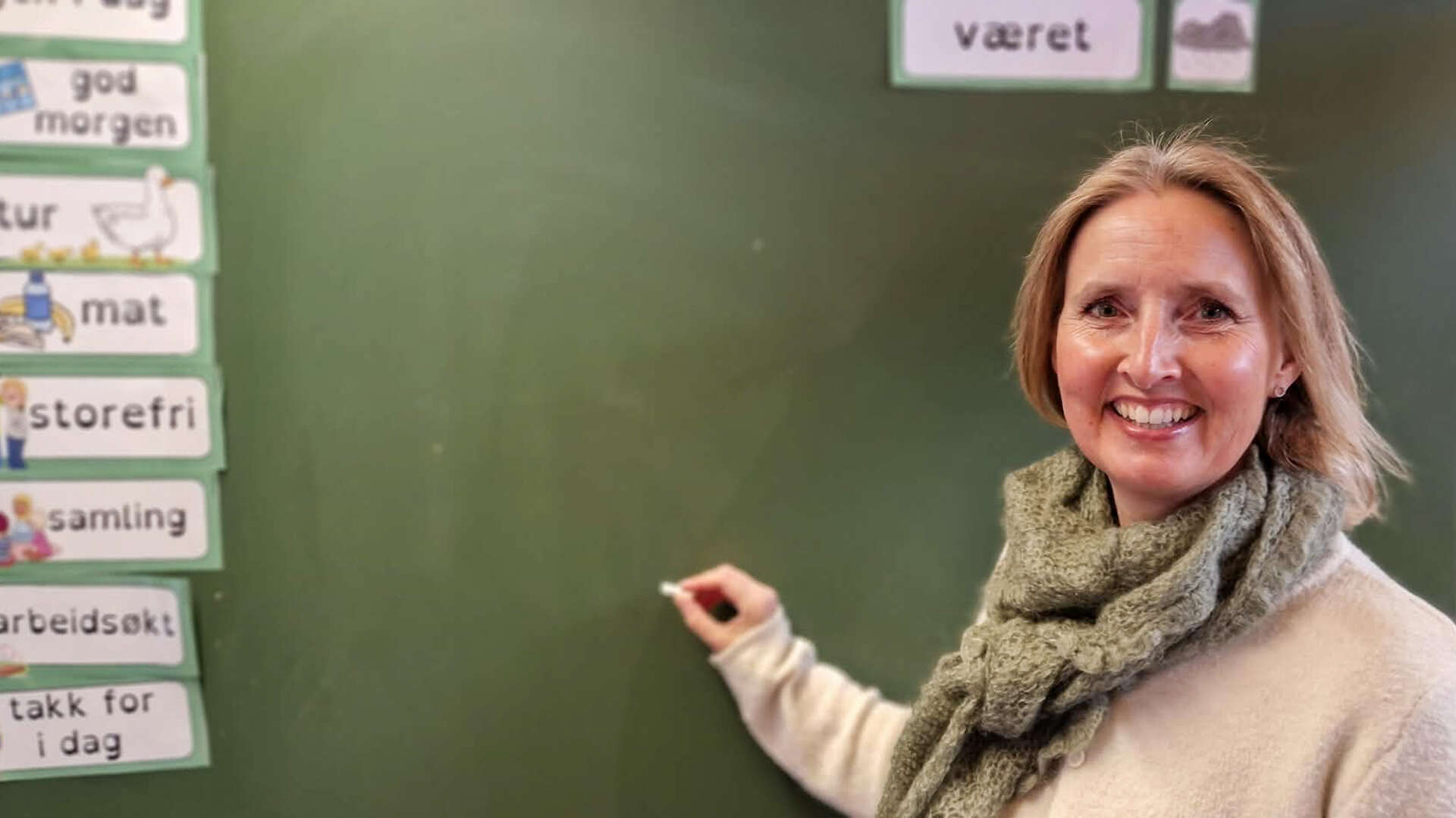 Woman in front of a blackboard