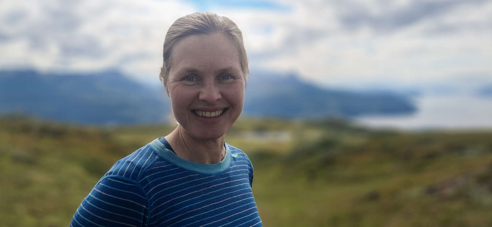 Woman with blue shirt in nature