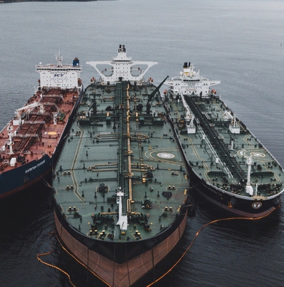 One big oil tanker and two small supply ships in Murmansk Russia