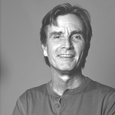 Portrettbilde av en smilende Erik Tresse