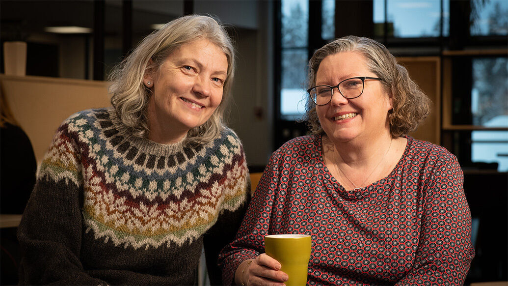 Two female chaplains smile at the camera