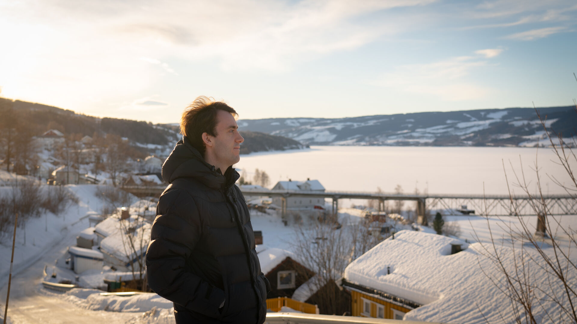 Stian is looking across a snow-covered landscape.