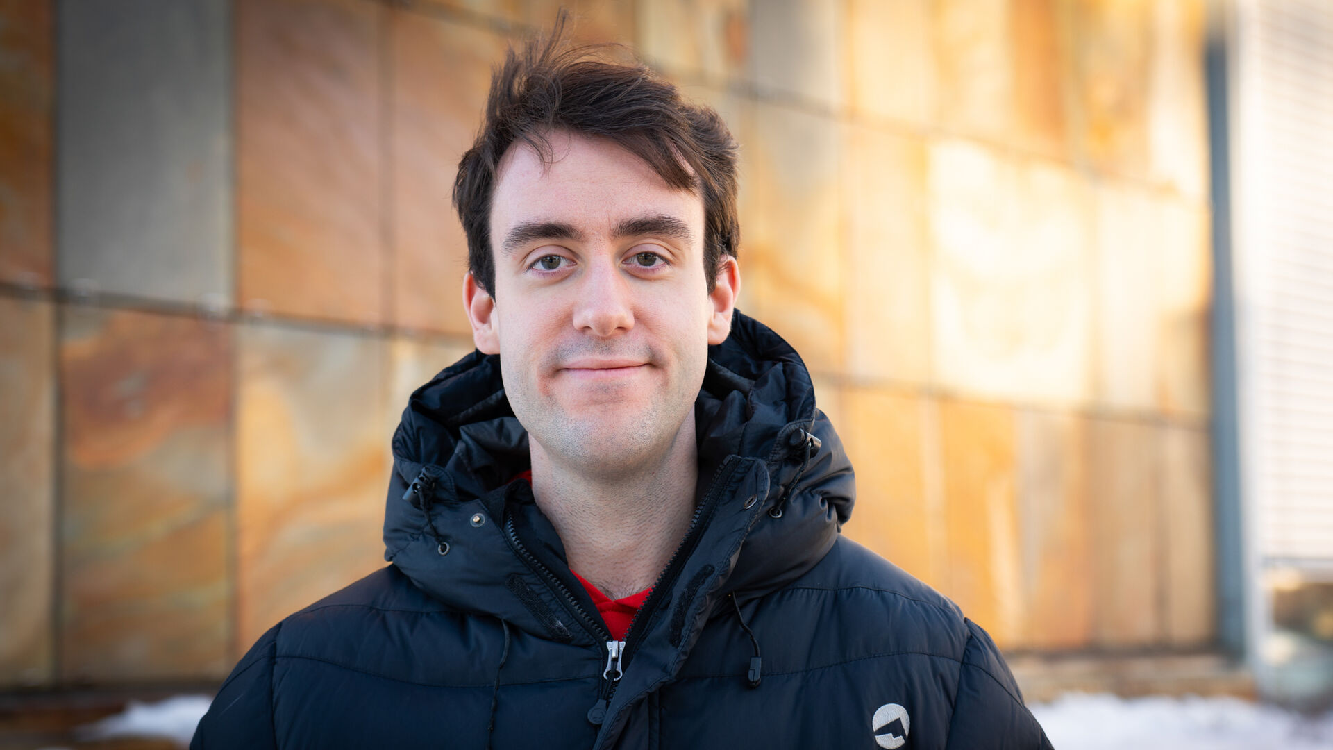 Portrait photo of Stian who is looking straight into the camera and smiling