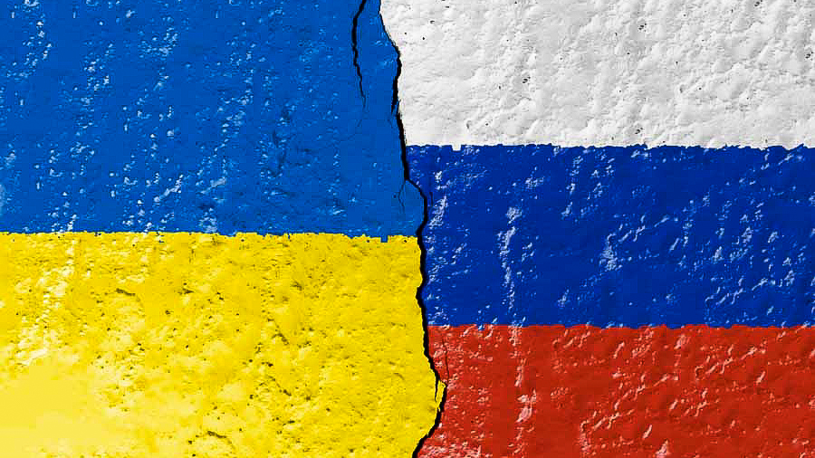 A combined Ukrainian and Russian flag with a rip in the middle. 