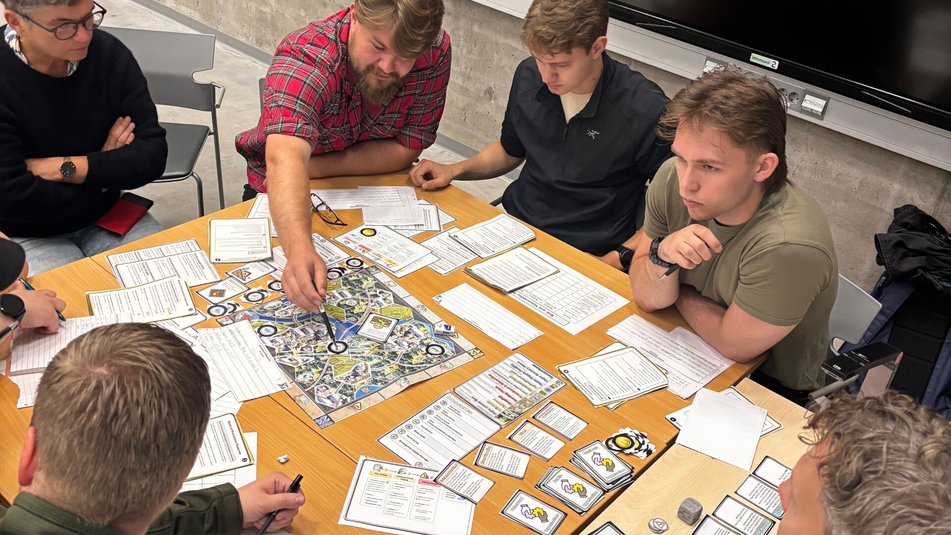 six people around a board game
