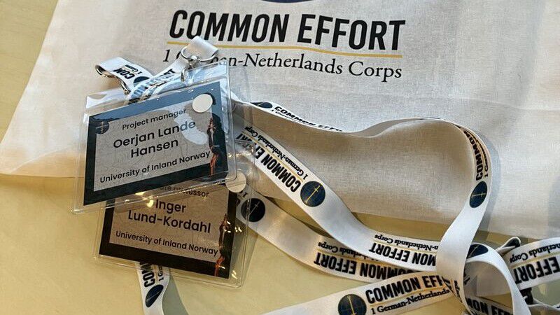 Bilde av deltakerkort med navn og Common Effort-merch.